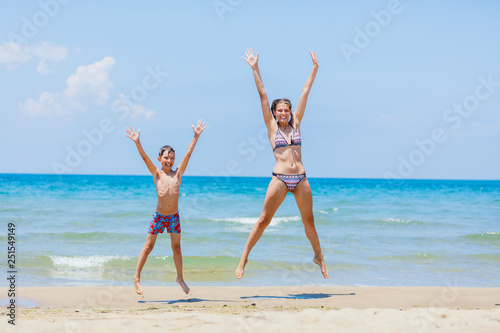 Happy kids having fun on tropical beach