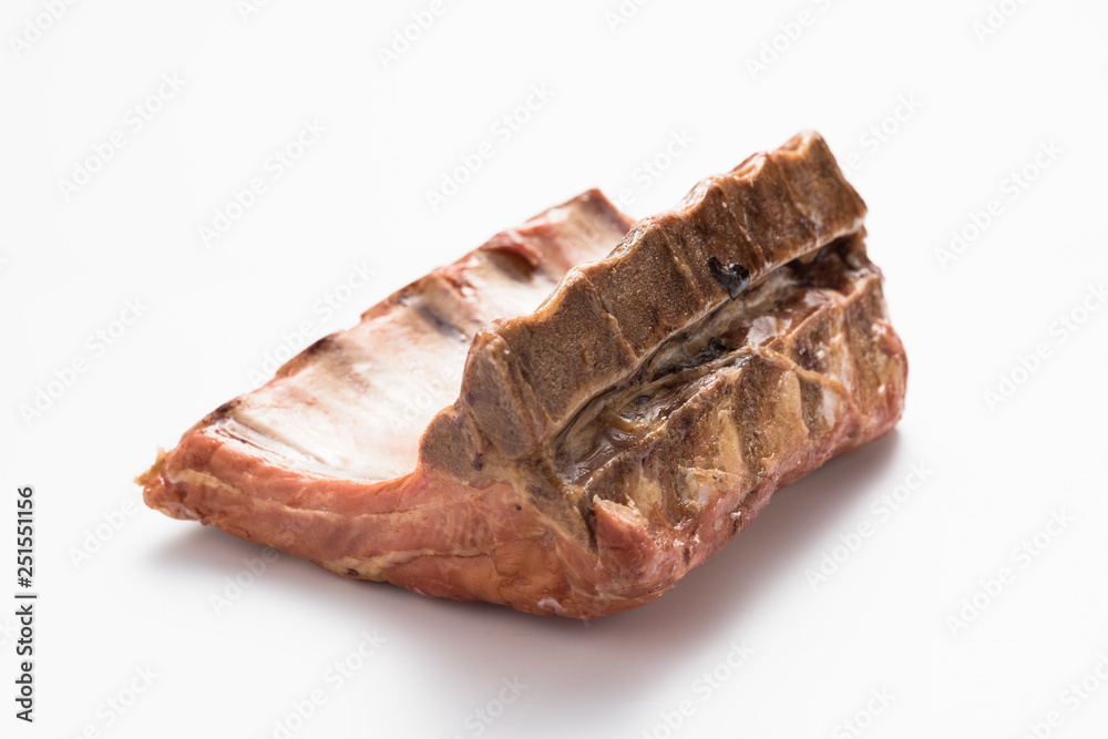 Smoked pork ribs on a white background. Smoked pork ribs on a white background.