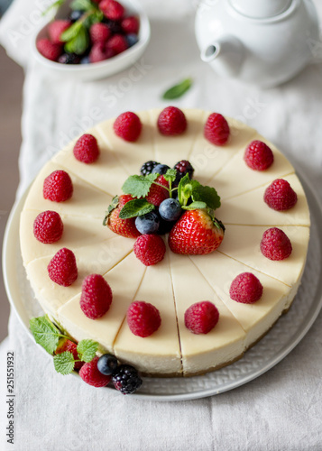 Cotton cheesecake with mint and strawberry on a gray plate. Close up