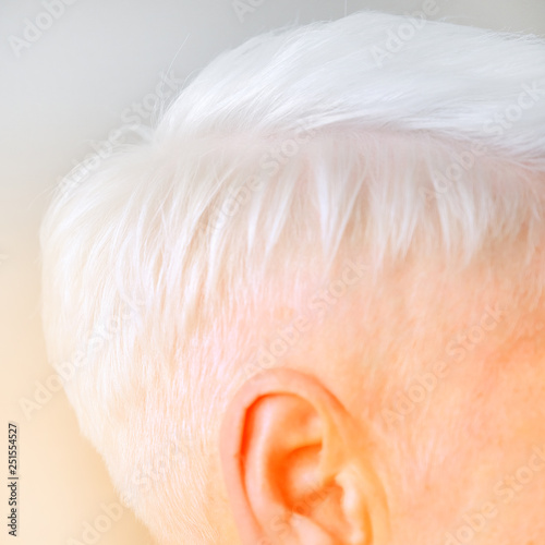 Women's short haircut. Fashionable stylish profile with white short hair. Nice neat back of the head of a girl with a haircut. Hairstyle women.