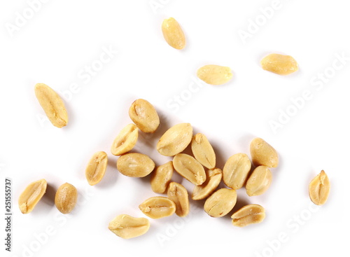 Salted and fried, roasted peanuts, pile isolated on white background, top view