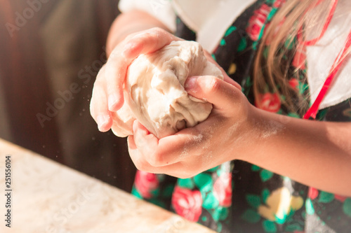 Children's hands mold dough
