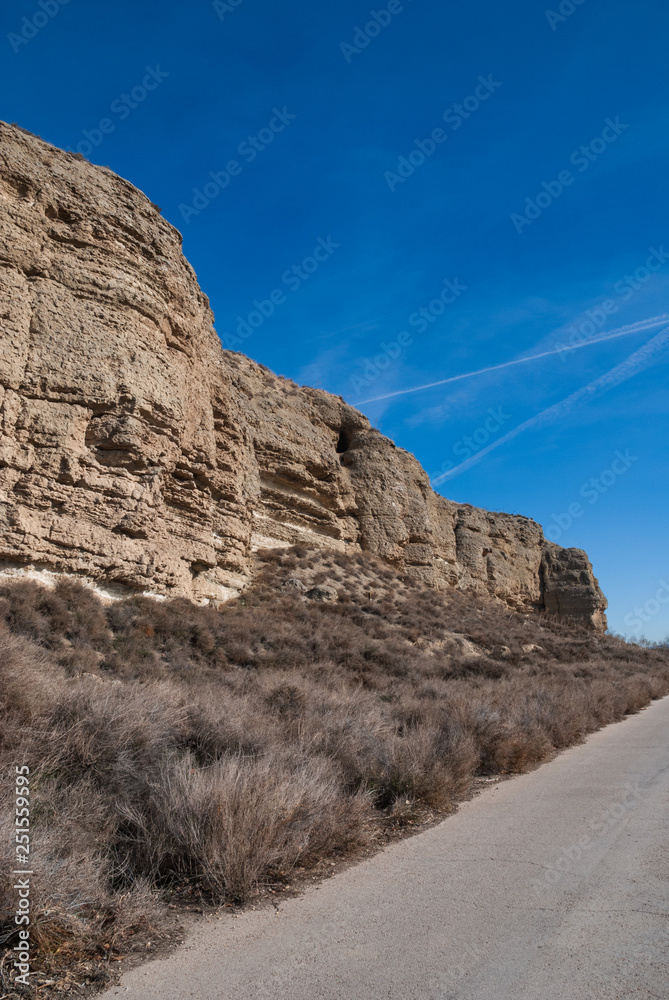 landscape of desert hill with road. Located in the town of Rivas in Madrid. Spain