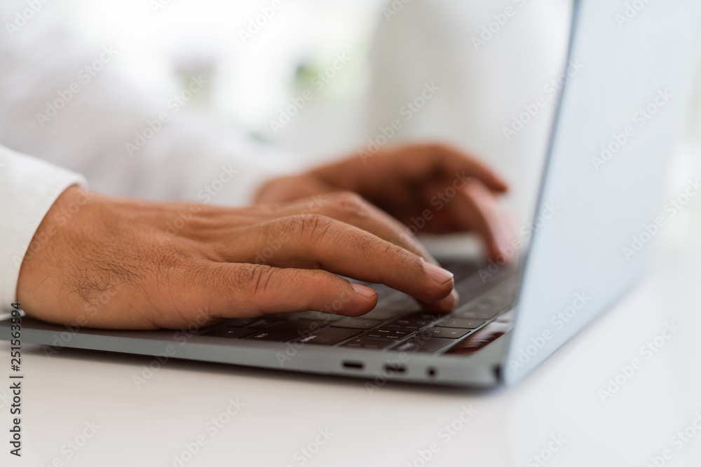 Close up of business man working using computer laptop Close up of business man working using computer laptop