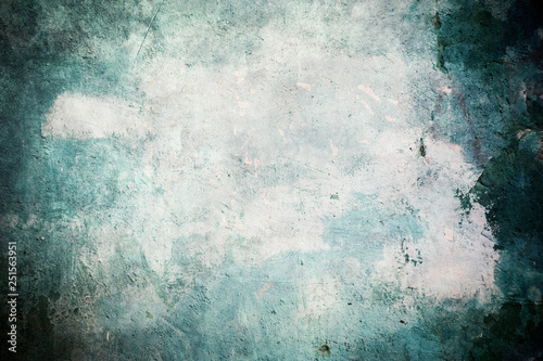 Old blue grungy wall background or texture photo