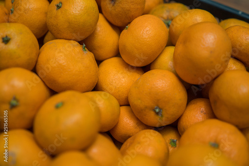 Bright background of ripe orange mandarins