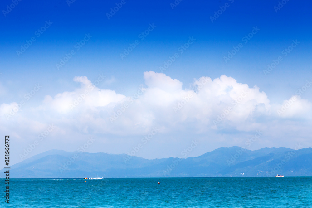 Wide seascape with clouds and mountains