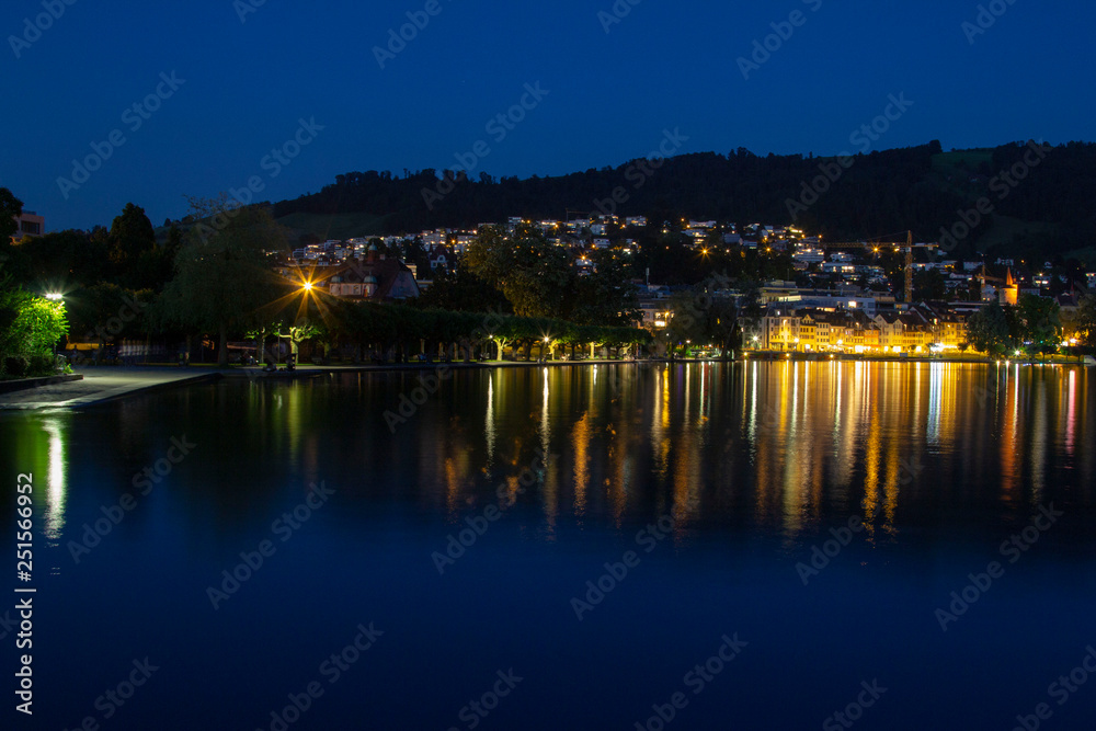 Lake of Zug city in Switzerland at night in summer