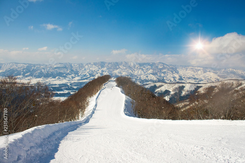 Landscape and Mountain view of Nozawa Onsen in winter with sunrise background  , Nagano, Japan. photo