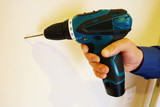  Electric drill. Man hold drill. Maintenance home concept