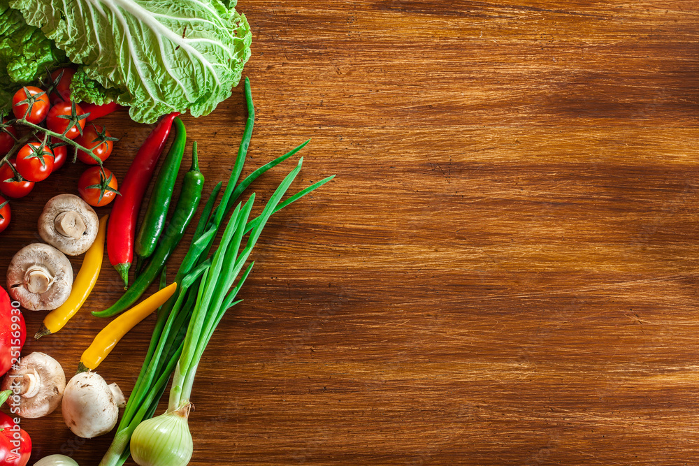 Fresh vegetable borders on wooden background Fresh vegetable borders on wooden background
