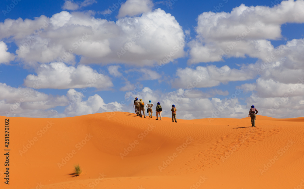 people walk of the Sahara desert