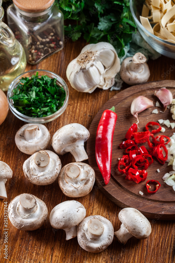 Ingredients ready for prepare tagliatelle pasta with champignon