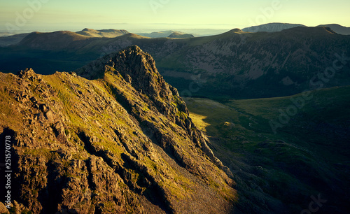 Sunrise over Ennerdale from Scoat Fell with views of Steeple In the English Lake District, UK.