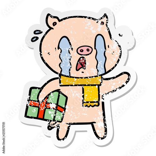 distressed sticker of a crying pig cartoon delivering christmas present