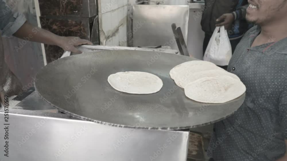 Cook prepares chapati