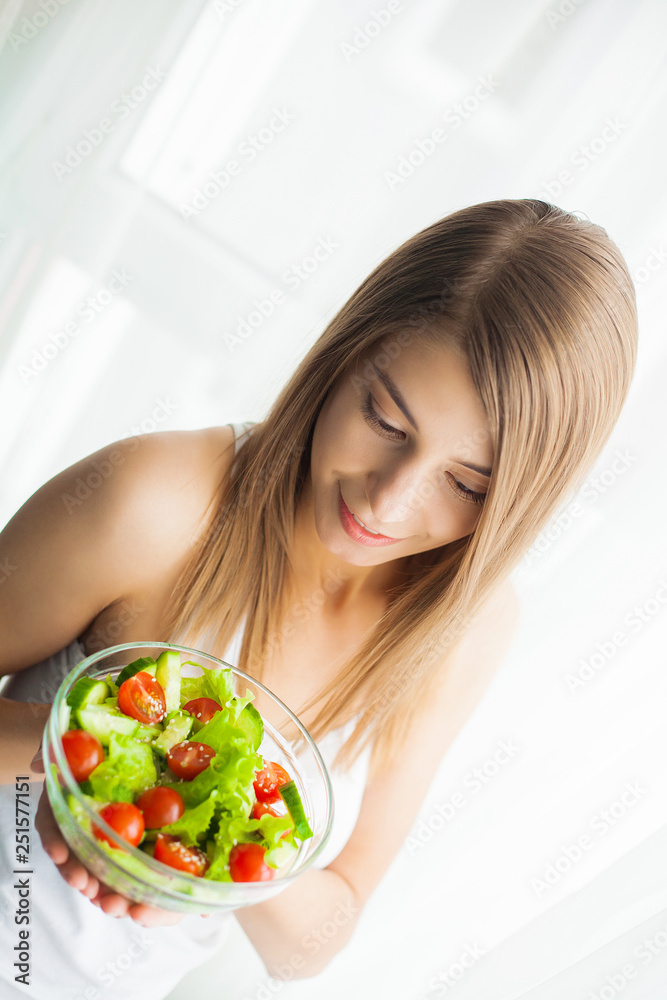 Diet and Healthy eating. Young woman eating healthy salad after workout Diet and Healthy eating. Young woman eating healthy salad after workout
