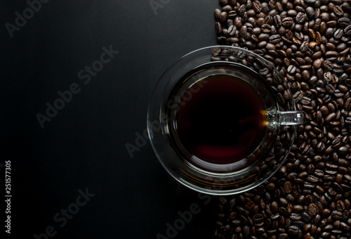 Coffee cup and coffee beans on table