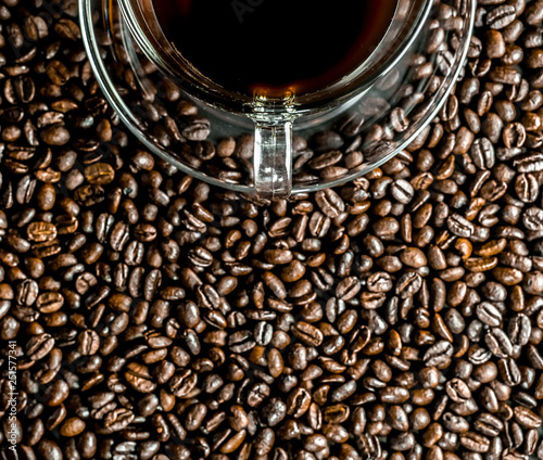 Coffee cup and coffee beans on table