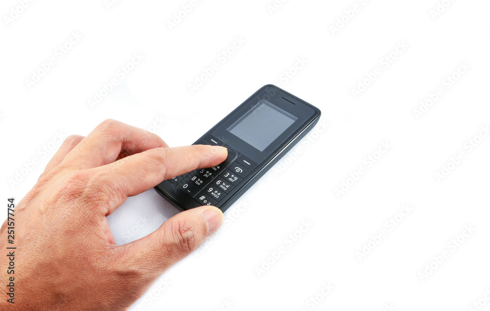 Hand pressing on Telephone / Old model mobile phone isolated on white background Hand pressing on Telephone / Old model mobile phone isolated on white background