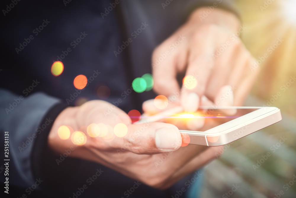 Close up man hand hold using smart phone on outdoor park street background. Close up man hand hold using smart phone on outdoor park street background.