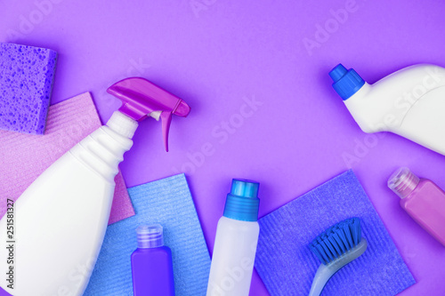 House cleaning products are on purple background.