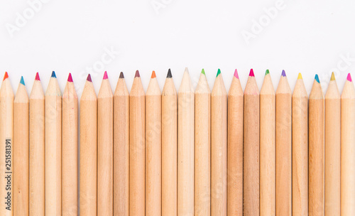 set of colored pencils on a white background