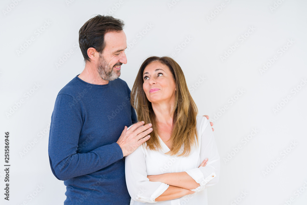 Beautiful middle age couple in love over isolated background smiling looking side and staring away thinking. Beautiful middle age couple in love over isolated background smiling looking side and staring away thinking.