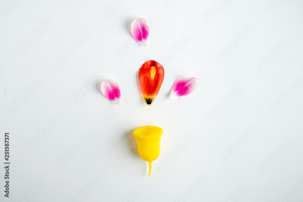 menstrual cup with flower tulip. concept on women alternative hygiene menstrual cup with flower tulip. concept on women alternative hygiene