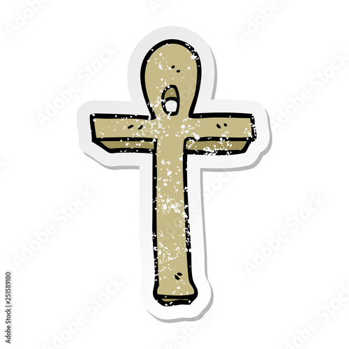 distressed sticker of a cartoon ankh symbol