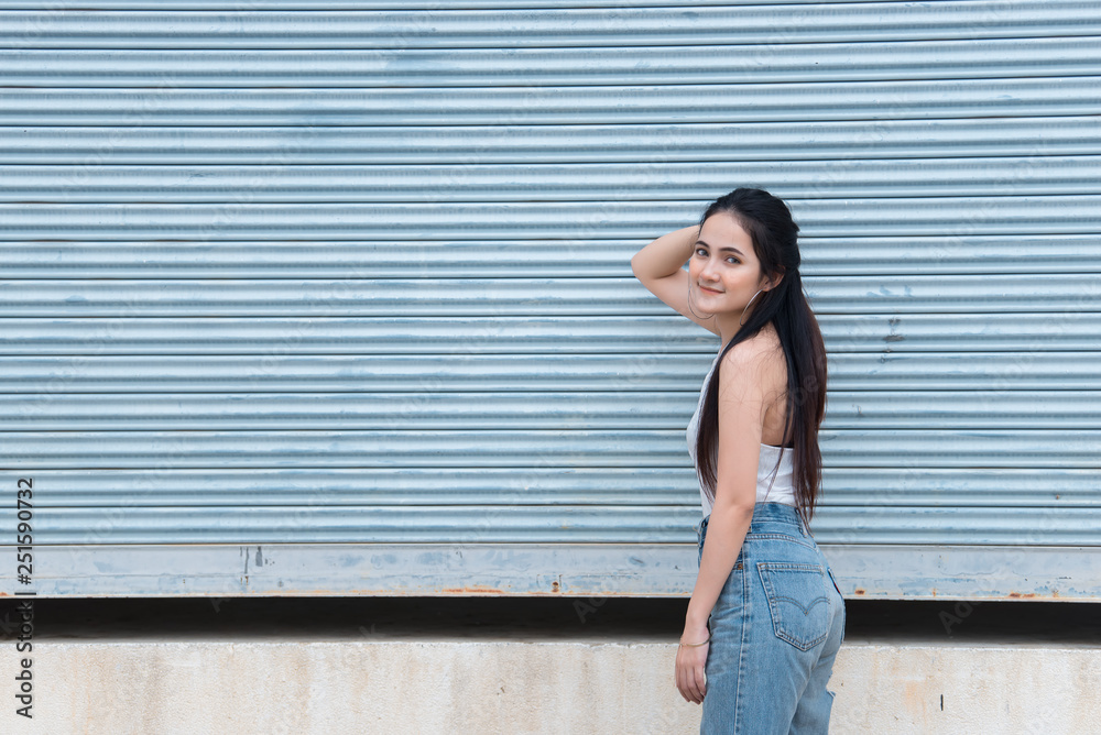 Portrait of beautiful asian chic girl pose for take a picture on wall background,Lifestyle of teen thailand people,Modern woman happy concept Portrait of beautiful asian chic girl pose for take a picture on wall background,Lifestyle of teen thailand people,Modern woman happy concept