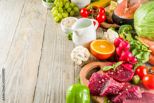 Flexitarian diet diet, with fresh vegetables, raw meat and fish, legumes, grains, fruit, wooden background, copy space top view
