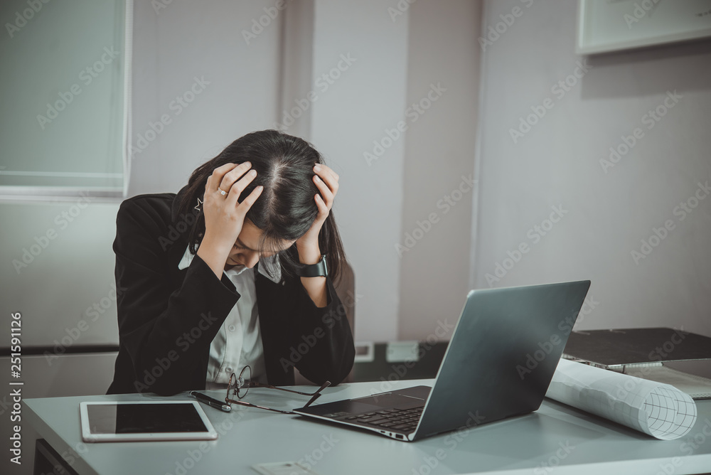 Asian woman working in office,young business woman stressed from work overload with a lot file on the desk,Thailand people thinking something Asian woman working in office,young business woman stressed from work overload with a lot file on the desk,Thailand people thinking something