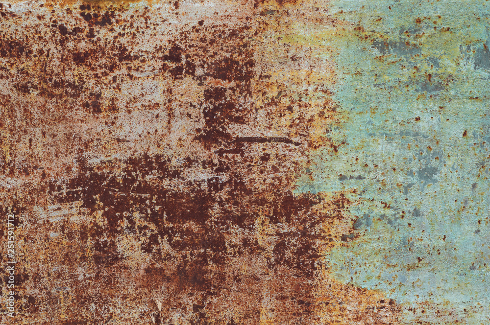 background from an old rusty sheet of metal with faded shabby peeling green paint