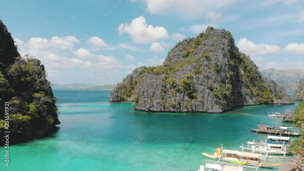 Stunning aerial view of Kayangan Lake in Coron island, Palawan, Philippines. Turquoise water, cliffs, island hopping, boats, jungle / 4K Drone Video Stunning aerial view of Kayangan Lake in Coron island, Palawan, Philippines. Turquoise water, cliffs, island hopping, boats, jungle / 4K Drone Video