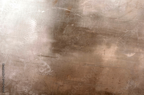 background from a sheet of old shabby and scratched gray sheet of metal