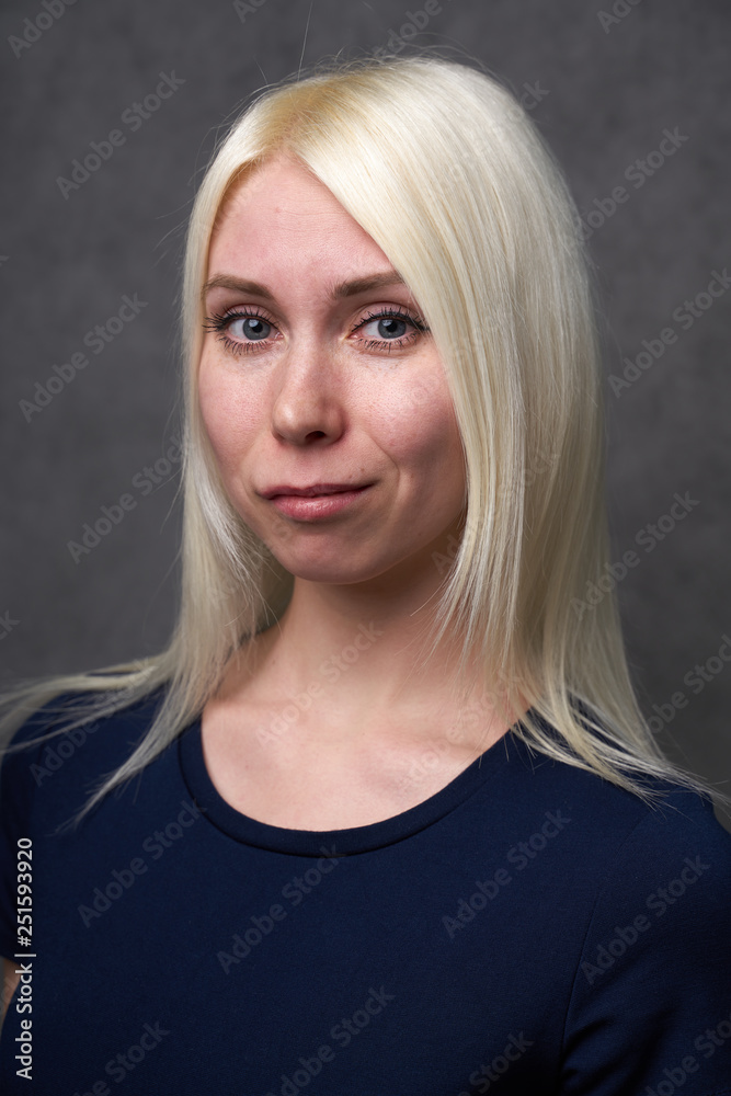 beauty female blond in black casual clothes on gray background beauty female blond in black casual clothes on gray background