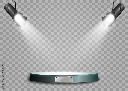  The spotlight shines on the stage.Llight from a lamp or spotlight. Lighted scene. Podium under the spotlight.