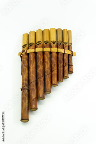 Pan flute instrument on white background.