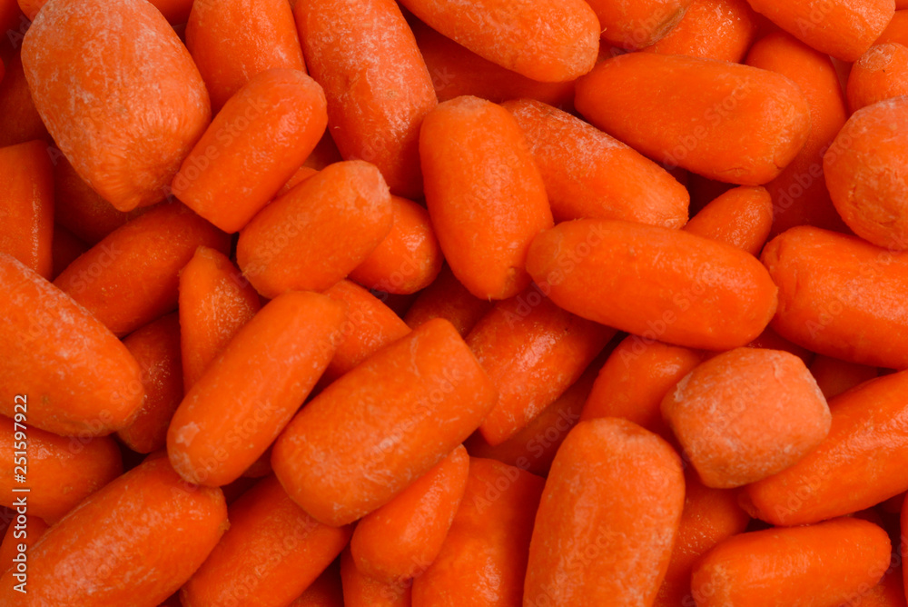 Little fresh carrots as a background. Snack. Little fresh carrots as a background. Snack.