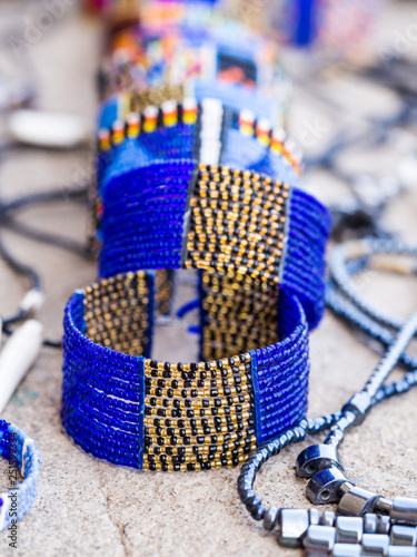 Obraz na płótnie Maasai baracelet and other jewelry sold as souvenirs in Arusha Region, Tanzania, Africa w salonie