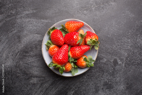 Fresh spanish strawberries in a bowl on a rustic table