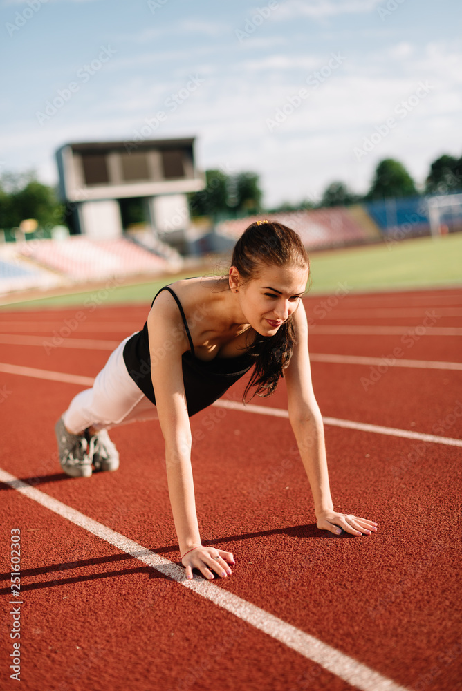 Girl athlete wrung out on the field on a sunny day Girl athlete wrung out on the field on a sunny day