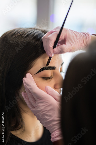 Young woman having brow color added to her eyebrows