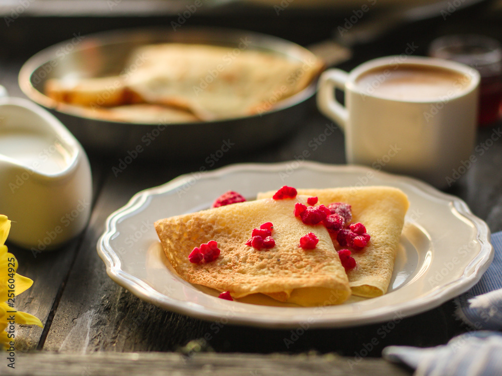 pancakes crepes fritters with raspberries (pancakes with filling) Maslenitsa. food background. top view pancakes crepes fritters with raspberries (pancakes with filling) Maslenitsa. food background. top view