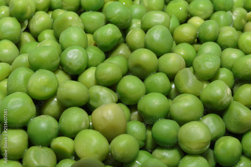 Heap of fresh green peas close-up. Concept of vegan food or natural background. Heap of fresh green peas close-up. Concept of vegan food or natural background.