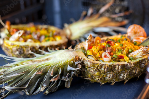 Rice in pineapple with seafood baked in the oven