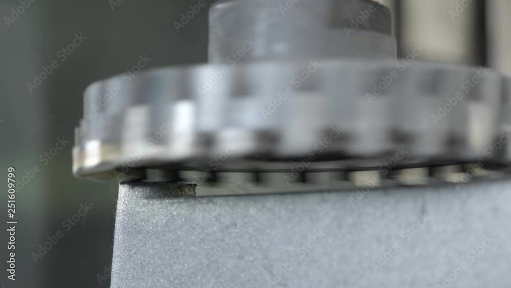 CNC Milling Machine Produces Metal Detail on Factory. Metalworking machine. Removes a layer of metal.