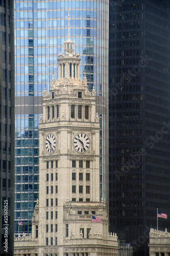 old Chicago clock tower with glass skyscrapers