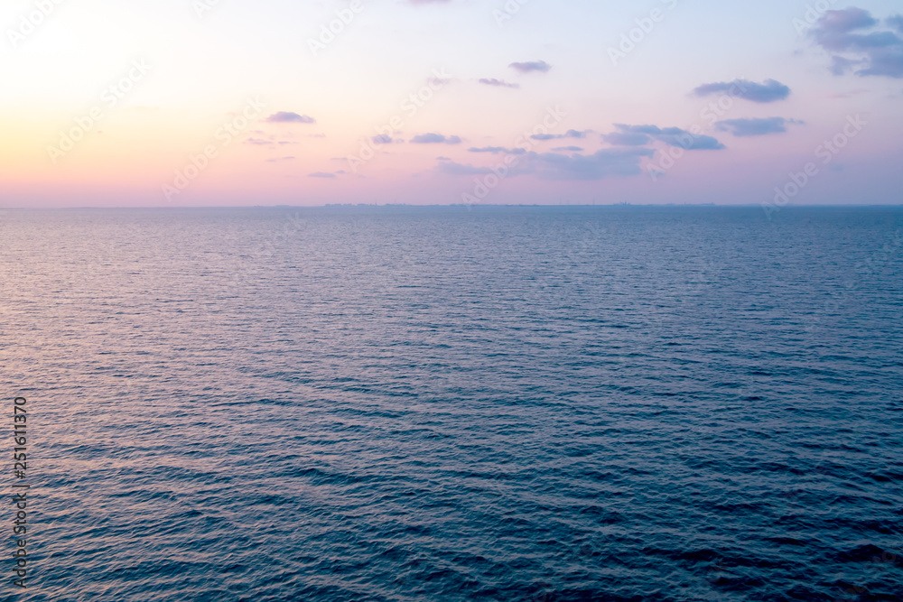 Obraz premium Colorful sunrise on the sea. View of the sea sunrise from the cruise ship